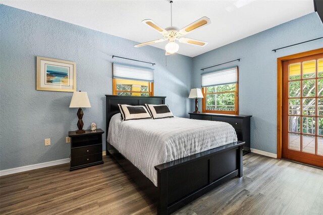 bedroom with ceiling fan and dark hardwood / wood-style flooring