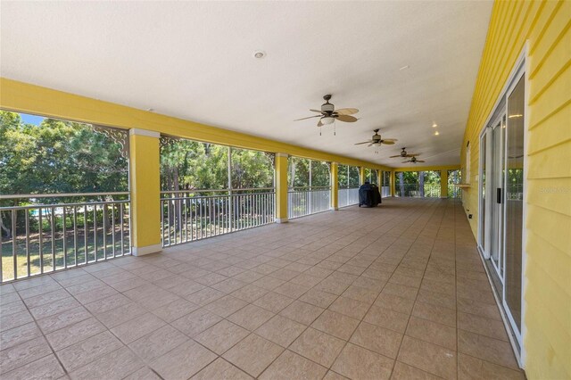 view of terrace featuring ceiling fan and a balcony