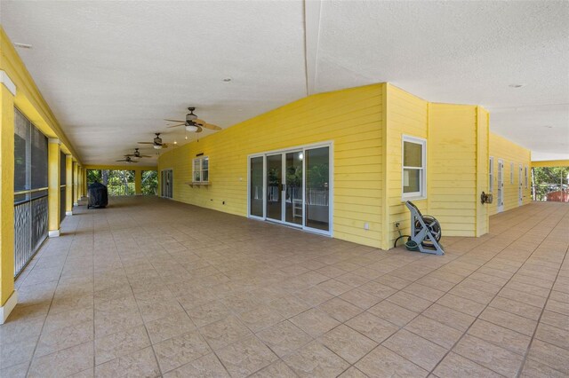 exterior space featuring ceiling fan