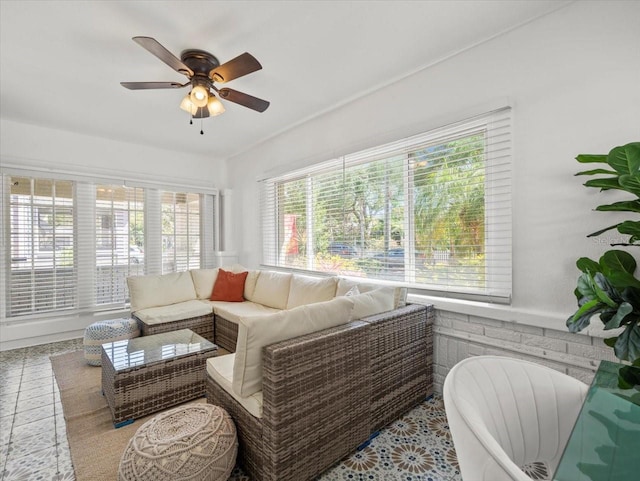 tiled living room featuring ceiling fan