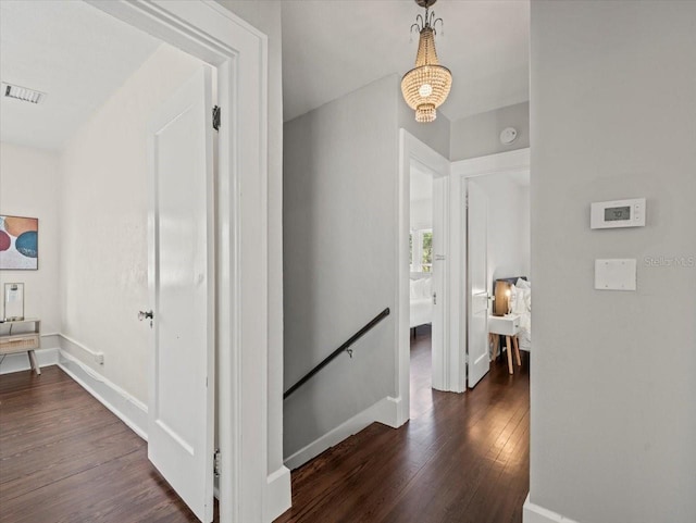 hallway featuring dark hardwood / wood-style flooring