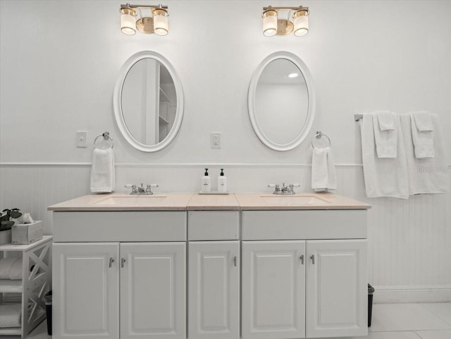 bathroom with double sink vanity and tile floors