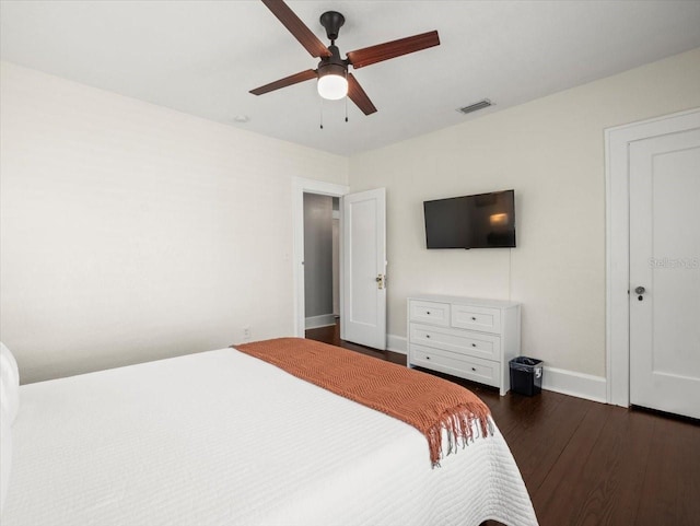 bedroom featuring ceiling fan and dark wood-type flooring