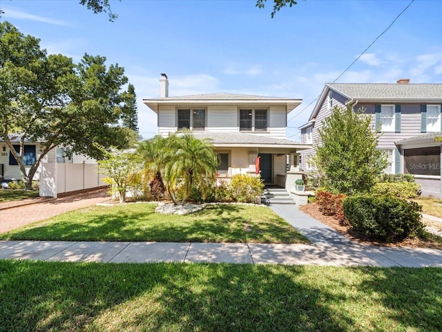 front facade with a front yard