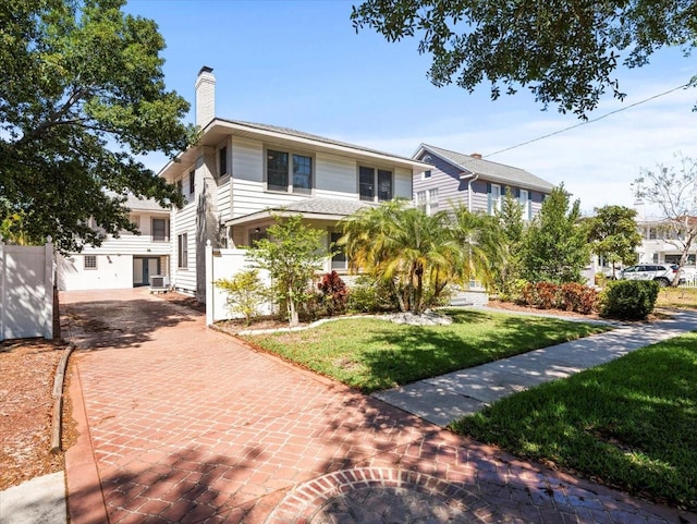 view of front of home with a front lawn