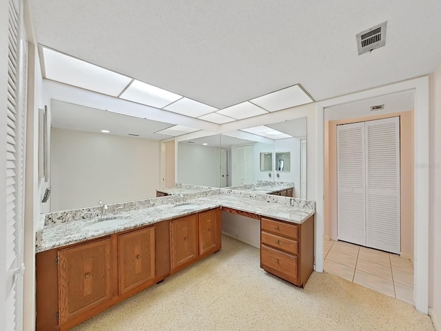 bathroom with vanity and tile patterned floors