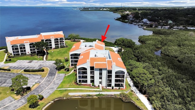 birds eye view of property featuring a water view