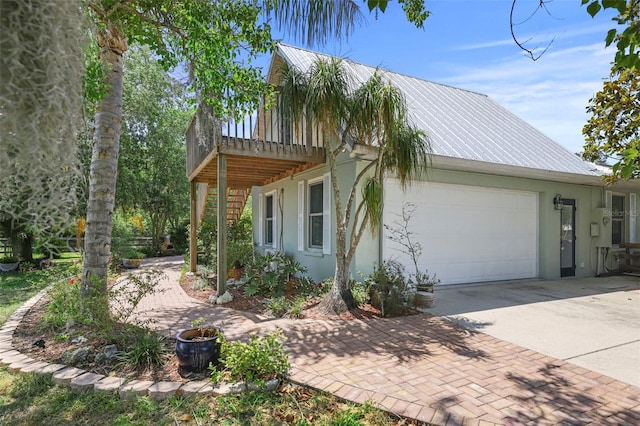 view of side of home with a garage