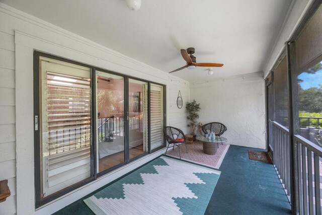 sunroom / solarium with ceiling fan