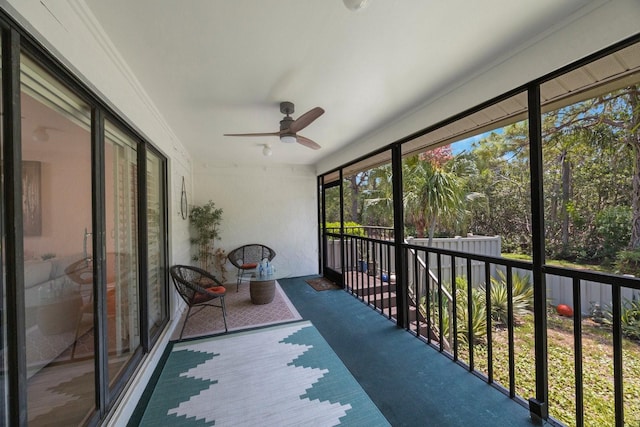 sunroom / solarium with ceiling fan