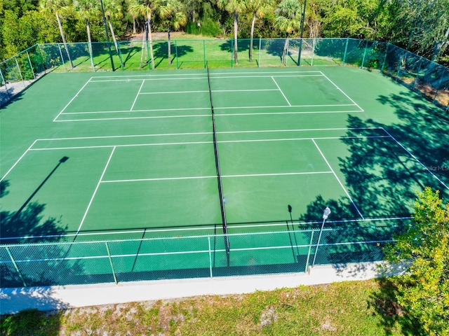 view of tennis court with fence