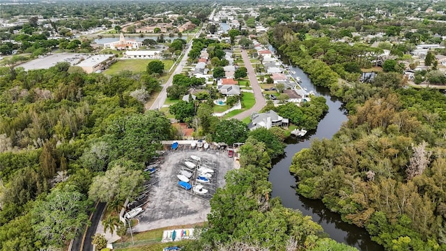 drone / aerial view with a water view and a residential view