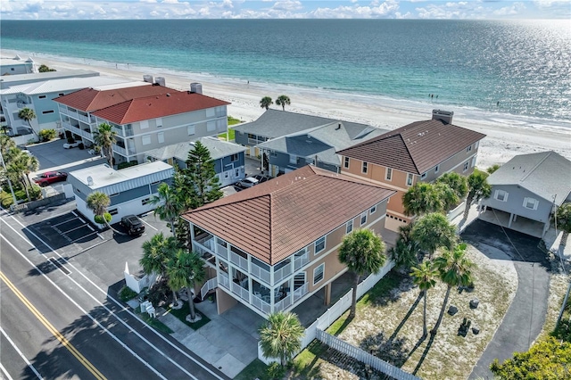 aerial view with a beach view, a residential view, and a water view