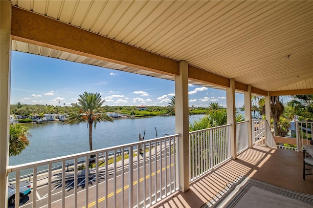 balcony featuring a water view