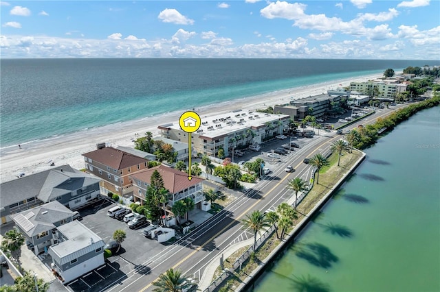 aerial view featuring a view of the beach and a water view