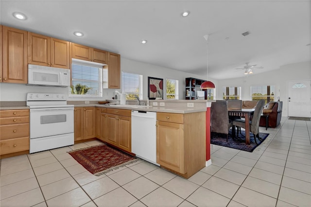 kitchen with light tile patterned flooring, sink, white appliances, ceiling fan, and kitchen peninsula