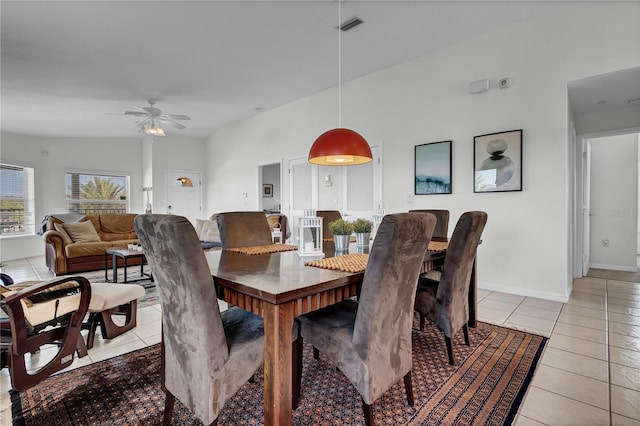 dining area with visible vents, ceiling fan, light tile patterned flooring, and baseboards