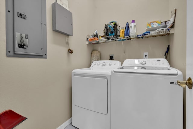 washroom featuring independent washer and dryer and electric panel