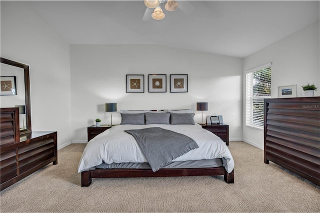 bedroom featuring baseboards, carpet, and vaulted ceiling