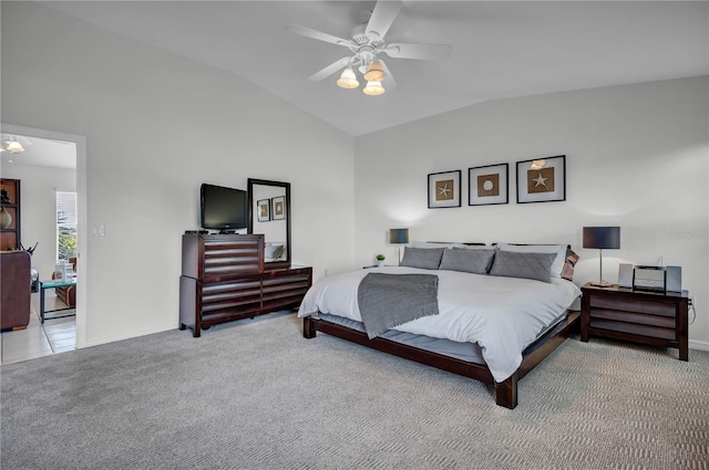 bedroom with ceiling fan, carpet, vaulted ceiling, and baseboards