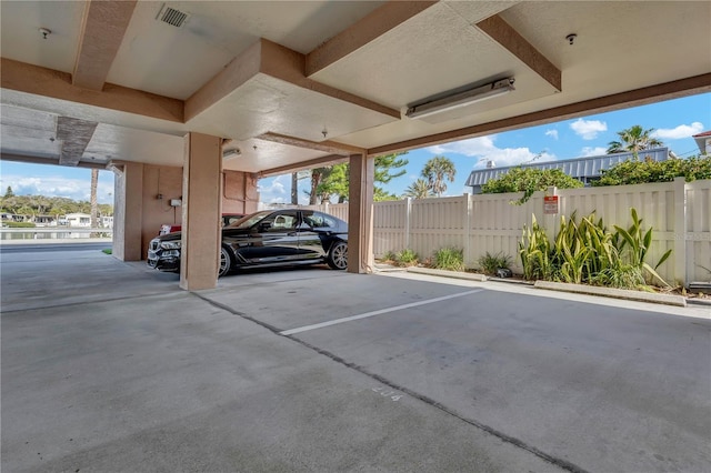 view of vehicle parking featuring a carport