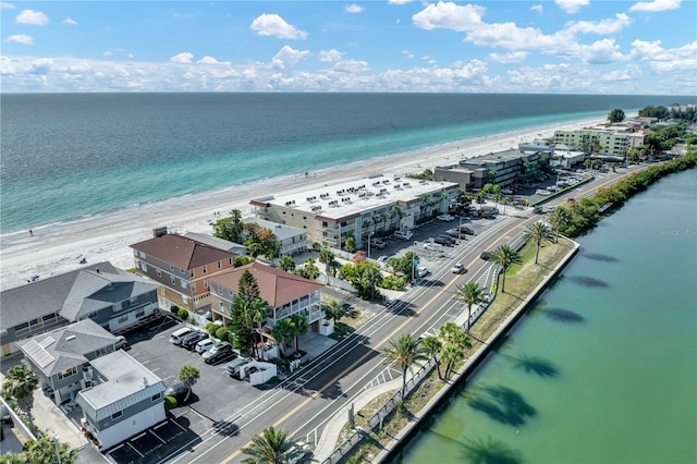 birds eye view of property with a beach view and a water view