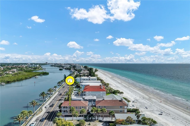 bird's eye view with a water view and a beach view