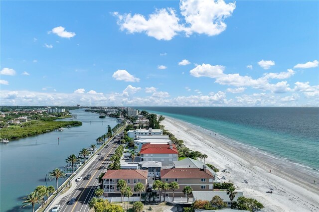 drone / aerial view with a water view and a view of the beach