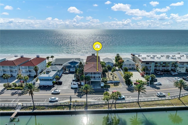 drone / aerial view featuring a water view and a residential view