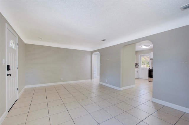 empty room featuring light tile floors