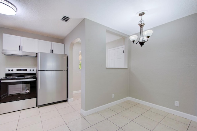 kitchen with hanging light fixtures, range with electric cooktop, light tile floors, and stainless steel fridge