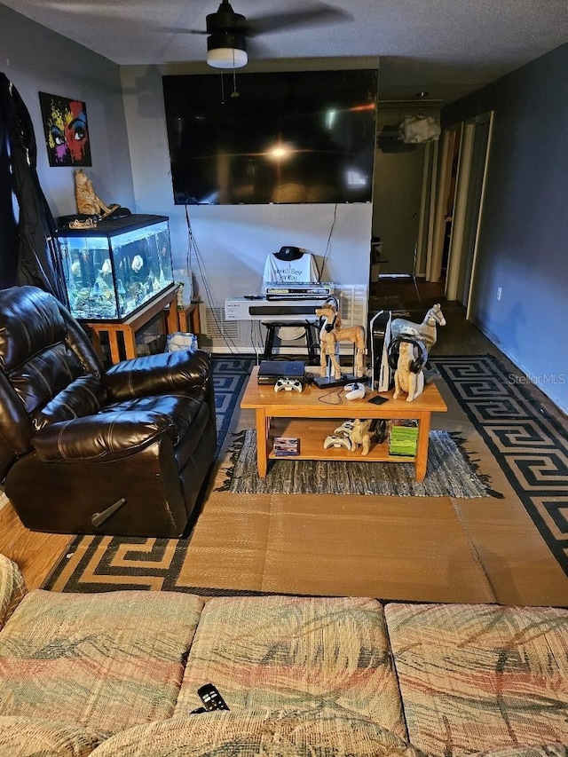 carpeted living room featuring ceiling fan