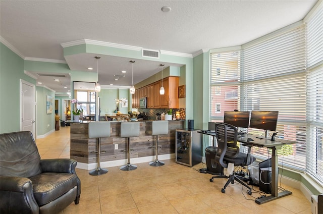 office featuring crown molding, a textured ceiling, and light tile floors