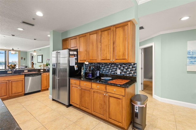 kitchen featuring decorative light fixtures, stainless steel appliances, light tile flooring, tasteful backsplash, and ornamental molding