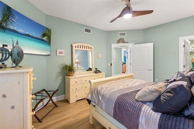 bedroom with ceiling fan and hardwood / wood-style flooring