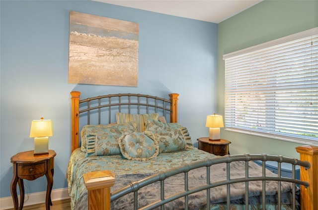 bedroom with wood-type flooring