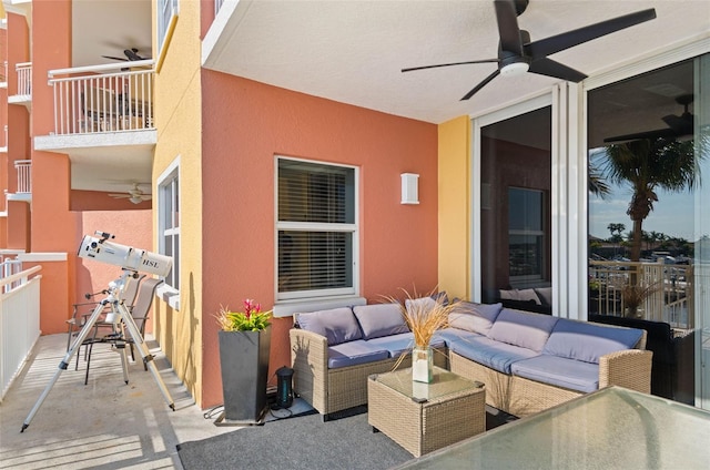 view of terrace with ceiling fan, a balcony, and an outdoor hangout area