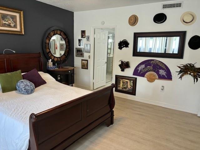 bedroom with light hardwood / wood-style flooring