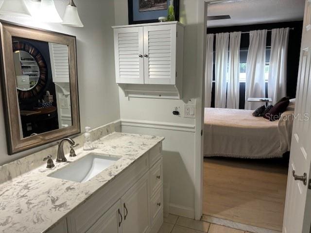 bathroom with vanity and tile floors