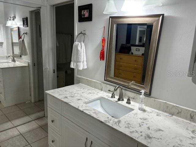 bathroom with large vanity and tile floors