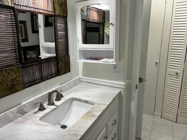 bathroom with oversized vanity and tile floors