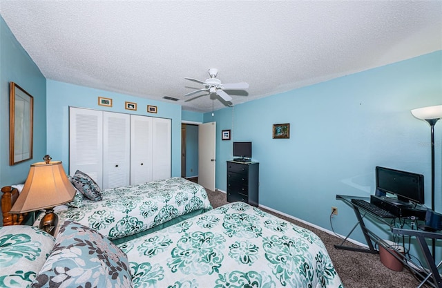 bedroom featuring a closet, a textured ceiling, dark colored carpet, and ceiling fan