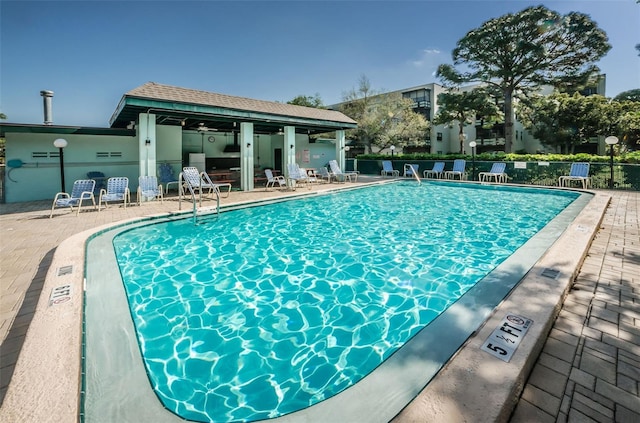 view of swimming pool with a patio area