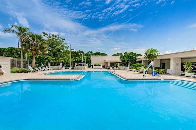 view of swimming pool featuring a patio