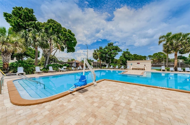 view of swimming pool with a patio