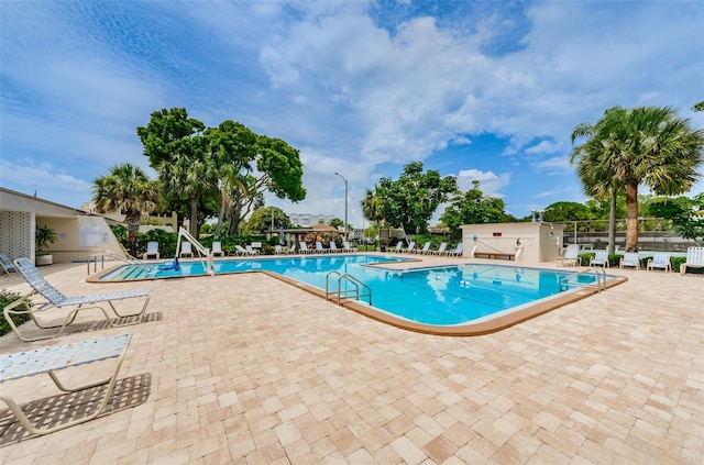 view of swimming pool with a patio area