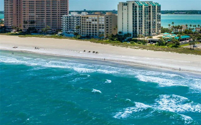 aerial view featuring a view of city, a water view, and a view of the beach