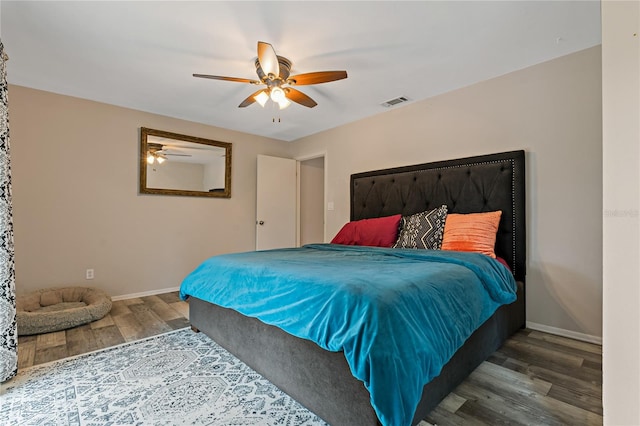 bedroom with hardwood / wood-style flooring and ceiling fan