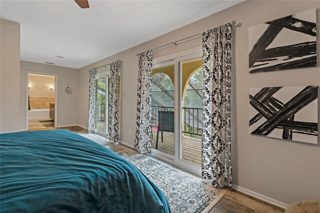 bedroom featuring hardwood / wood-style flooring, connected bathroom, ceiling fan, and access to exterior