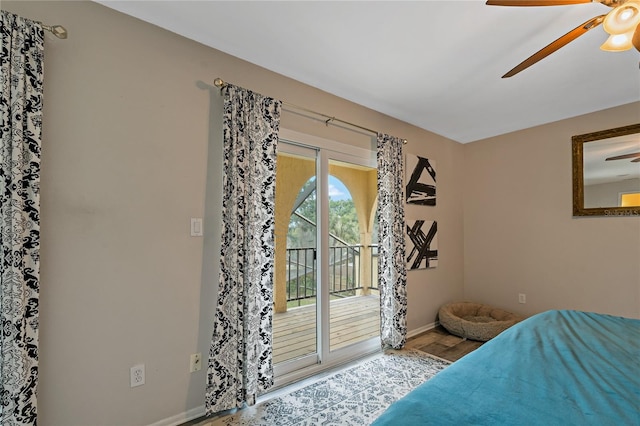 bedroom featuring ceiling fan and access to exterior